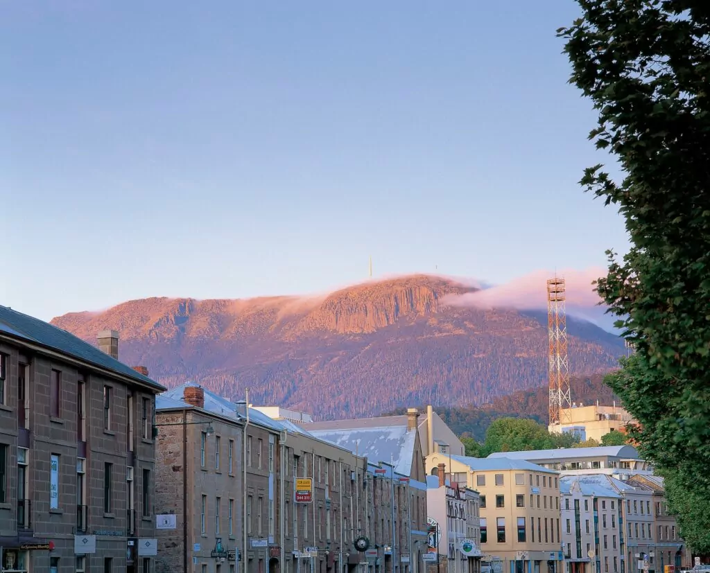 Looking at a pink Mount Wellington at sunrise from Salamanca in Hobart city